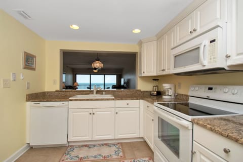 Full kitchen with granite countertops...and view of the Gulf!