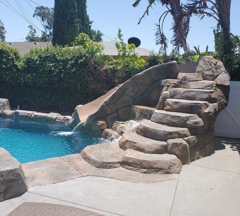 Renovated pool and rockslide.