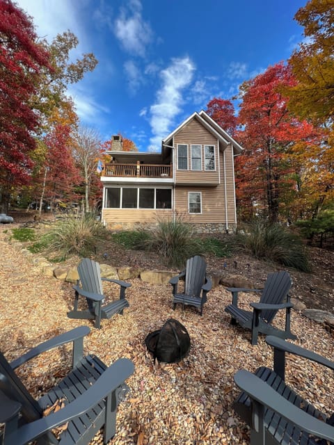 Back view of home in the fall. Beautiful foliage in this area with many maple. 