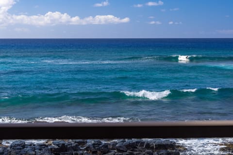 Hear the consistent roaring of the waves as you watch the surfers.