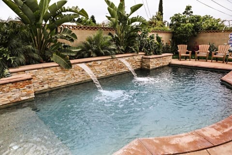 Beautiful Pool and In-ground Jacuzzi with Waterfall Feature