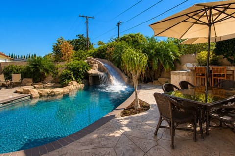 Pool with water slide and waterfall