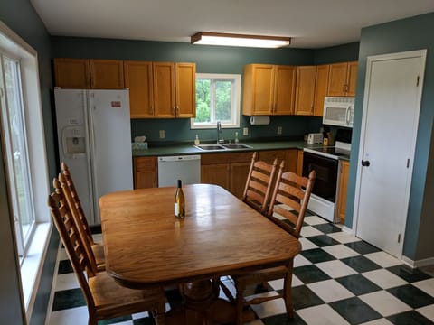 Kitchen table extends out for more seating. 4 additional chairs are available.