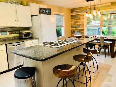 Kitchen with an island for cooking tasty meals.