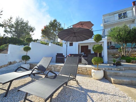 Plant, Property, Table, Sky, Furniture, Building, Shade, Outdoor Furniture, Tree, Lighting