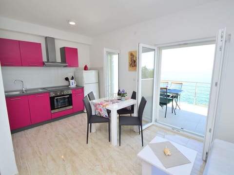 Table, Furniture, Cabinetry, Chair, Countertop, Building, Interior Design, Wood, Flooring, House