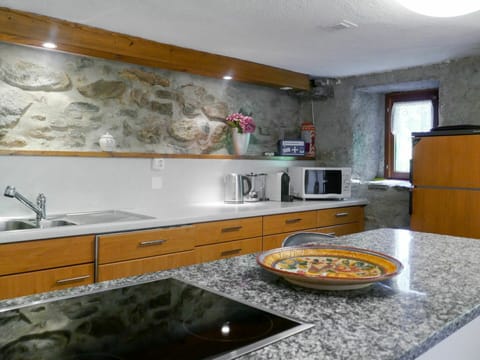 Countertop, Property, Room, Kitchen, Cabinetry, Interior Design, Furniture, Yellow, Tile, Sink