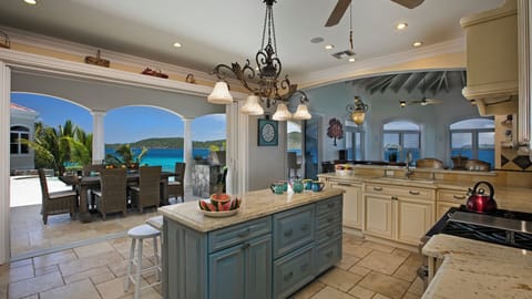 Fully furnished kitchen steps away from pool and living room