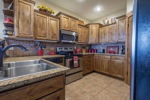 Refrigerator, dishwasher, microwave stove and walk in pantry closet