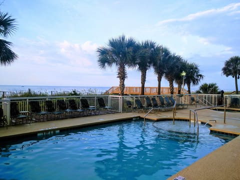 110' long outdoor oceanfront pool beside hot tubs and lazy river