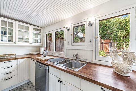 Cozy kitchen with courtyard and tree views.