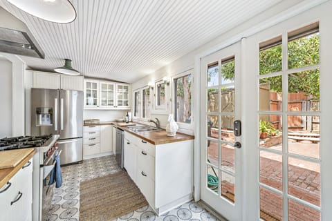 Full equipped kitchen with Wolf stove and large Fridge/Freezer. 
