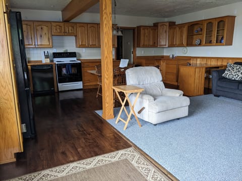 Entryway view of Living Space and Kitchen.