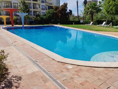 Water, Plant, Property, Building, Swimming Pool, Azure, Tree, Rectangle, Outdoor Furniture, Shade