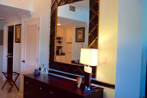 Bassett bureau with large mirror, door to washer/dryer closet on left