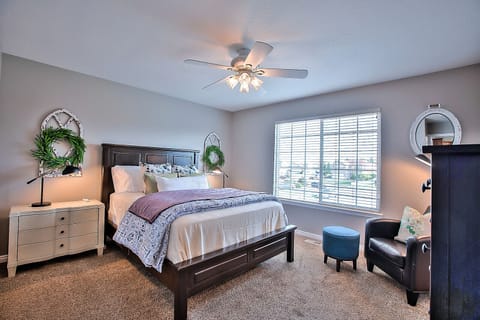 Master bedroom with queen bed, walk in closet, smart TV