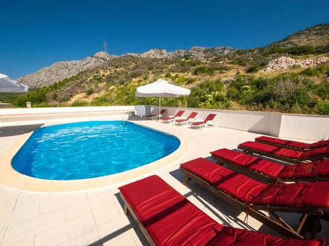 Water, Sky, Property, Swimming Pool, Building, Azure, Outdoor Furniture, Sunlounger, Tree, Shade
