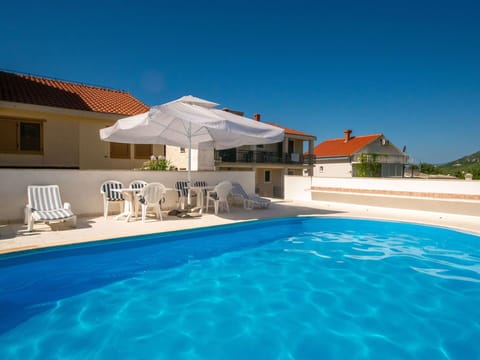 Water, Sky, Property, Building, Swimming Pool, Azure, House, Plant, Outdoor Furniture, Sunlounger