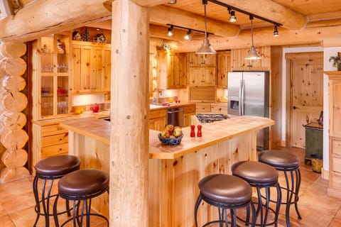 Kitchen fully stocked with every small appliance and gadget  needed for cooking.