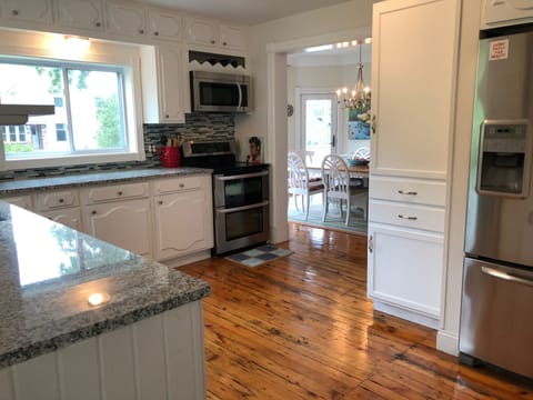 Updated and fully stocked kitchen with new fridge