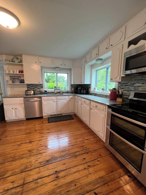 Updated kitchen, well stocked and adjoining dining area
