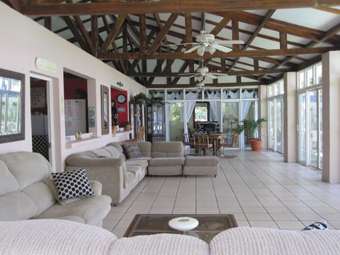 Huge living area overlooking ocean & pool. 2 sectionals & table. 4 ceiling fans.