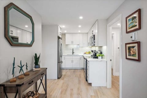 Modern kitchen with white cabinets and quartz countertop