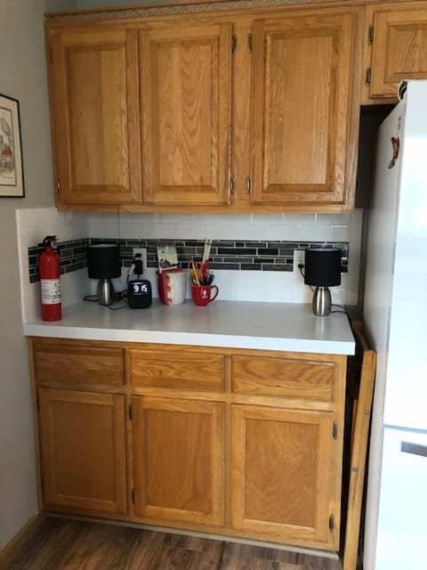 Kitchen cabinets.  Note the fire extinguisher.  A clock radio is there too. 