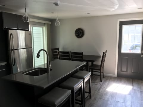 Plenty of seating w/ island stools and full dining room table w/ seating bench.