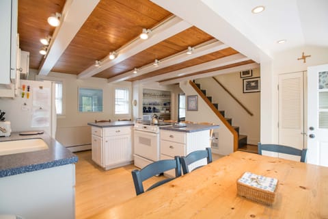 View from kitchen bench seating of fully equipped kitchen