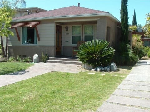 Grass lawn, shaded front porch
