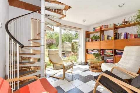 Sun room over looking south facing garden.  Lots of books and board games