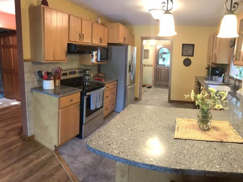 granite counter tops, stainless steel appliance and custom cabinetry