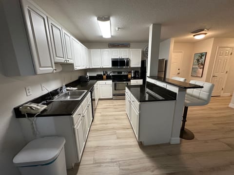 Large kitchen that is well stocked