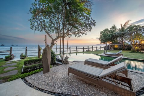 Lounge at the pool while watching the sunset