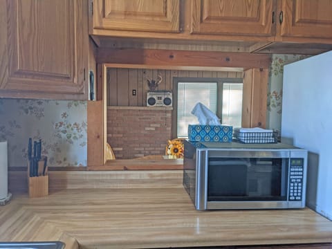 Looking through pass through to back living room from kitchen.