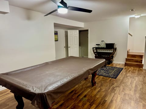 Billiards Table, Bar Cart with items for S'mores and Half Bath
