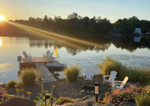 Private beach area with floating dock and fire pit