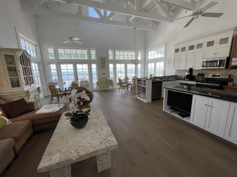 New Great Room with white interior and beautiful new tile floors.