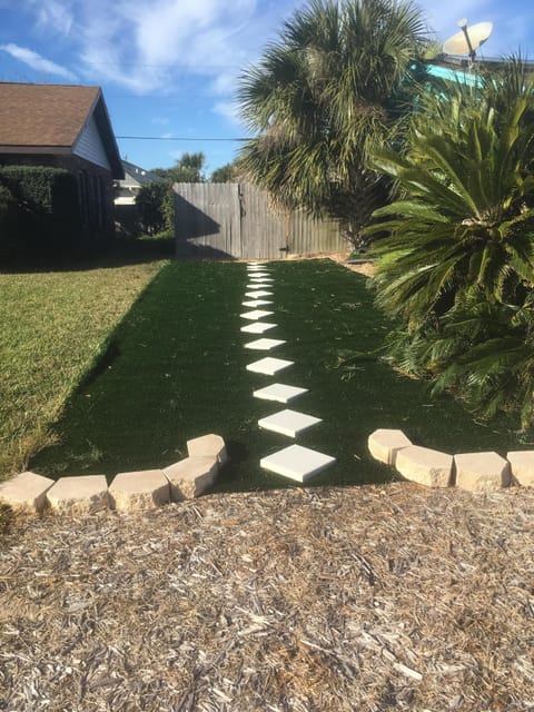 Additional parking area and walkway to back gate