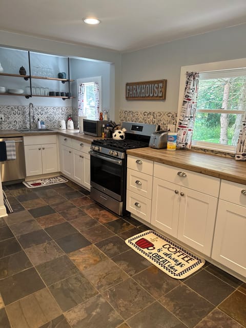 Fully stocked kitchen with stove and dishwasher
