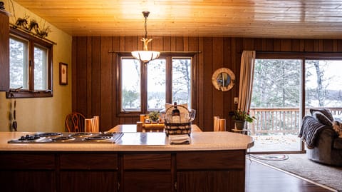 Kitchen looking into dining room and deck