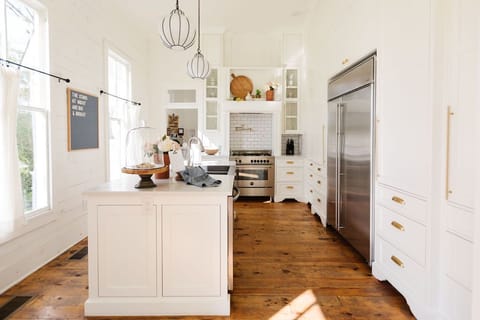 The kitchen is equipped with dishes, appliances and cookware for guests.