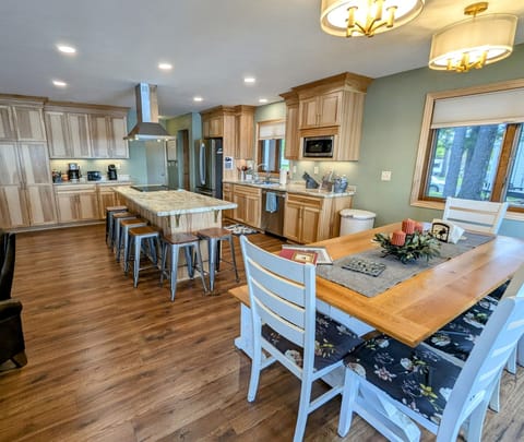 Plenty of seating between the dining room and island.