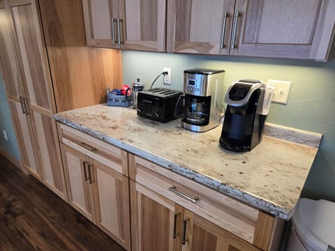 A coffee bar with a Keurig, traditional and french press coffee. 