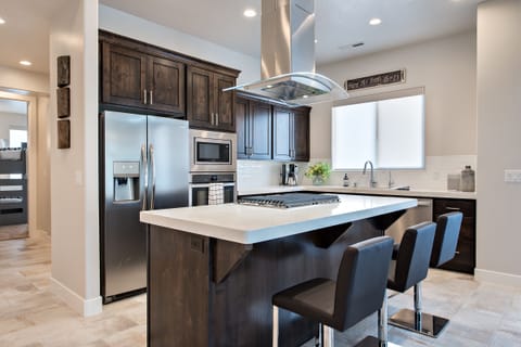 Kitchen View of Island - The Kitchen Island comfortably seats 3 adults and creates a great space for serving and preparing meals.