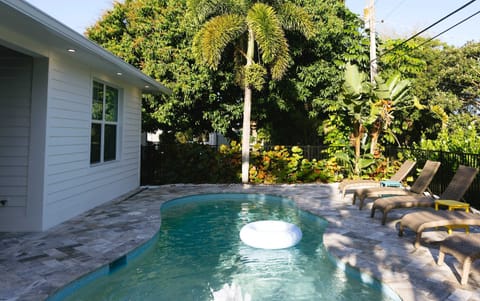 Beautiful Pool with Sun Loungers & Tropical Landscape