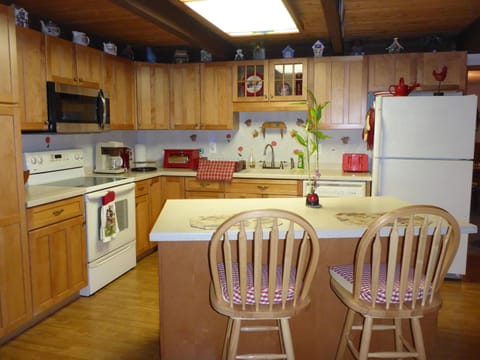 Kitchen with Corian Countertops
Bar seating and Dinette seats up to 8