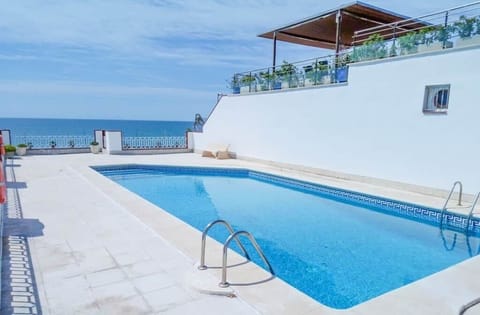 Sea-front shared swimming-pool sitting at 25m from the house entrance on the same walking side (for kids, no need to cross the road)