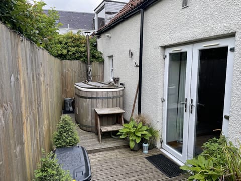 Private courtyard garden with wood fired hot tub. 